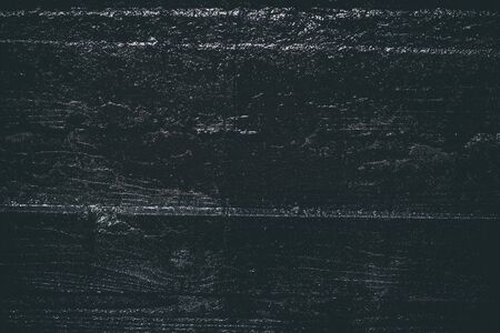 Black resin wall texture with scratches and cracks.の写真素材