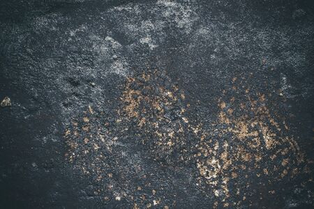 Black resin wall texture with scratches and cracks.の写真素材