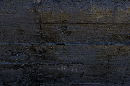 Black resin wall texture with scratches and cracks.の写真素材