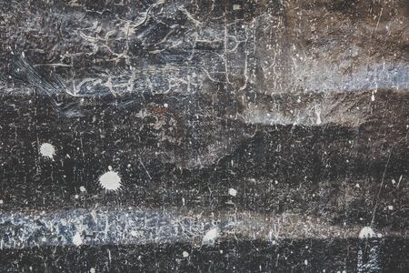 Scary black texture with white spots, scratches, and cracks.の写真素材