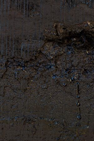 Black resin wall texture with scratches and cracks.の写真素材