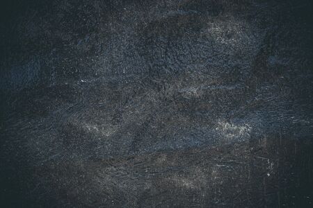 Black resin wall texture with scratches and cracks.の写真素材