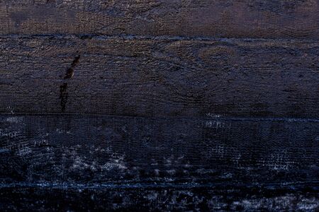 Black resin wall texture with scratches and cracks.の写真素材