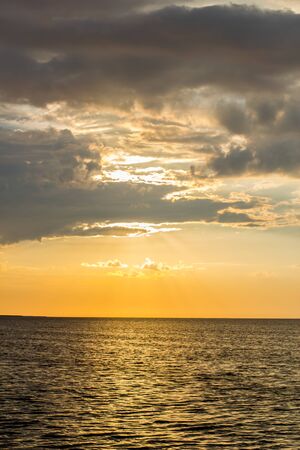 Beautiful sunset by the sea in summer in fine weatherの写真素材