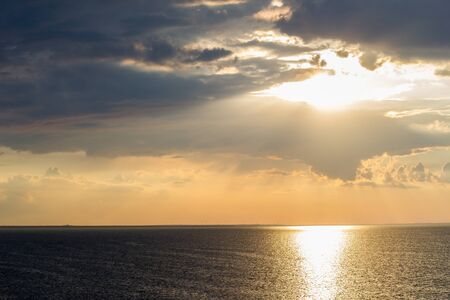 Beautiful sunset by the sea in summer in fine weatherの写真素材