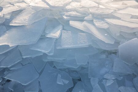 Large pieces of ice by the river in winterの写真素材