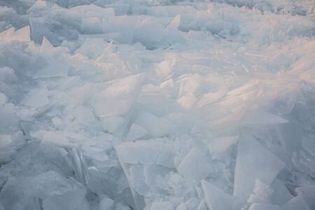 Large pieces of ice by the river in winterの写真素材