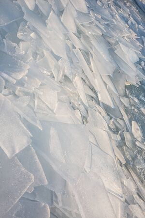 Large pieces of ice by the river in winterの写真素材