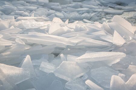 Large pieces of ice by the river in winterの写真素材