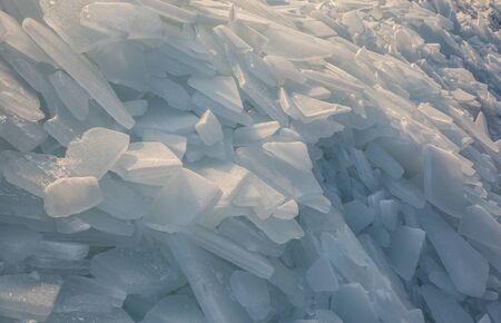 Large pieces of ice by the river in winterの写真素材