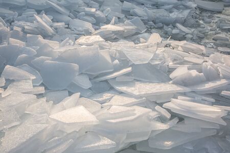 Large pieces of ice by the river in winterの写真素材