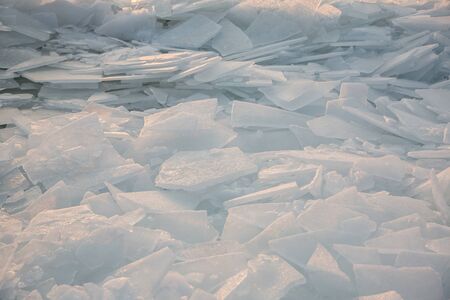 Large pieces of ice by the river in winterの写真素材