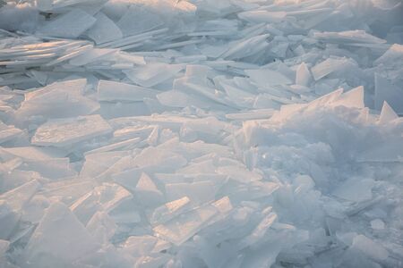 Large pieces of ice by the river in winterの写真素材