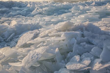 Large pieces of ice by the river in winterの写真素材