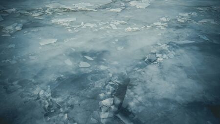 Bid on a frozen river with pieces of ice from a height of flight in the evening