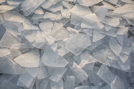 Large pieces of ice by the river in winterの写真素材