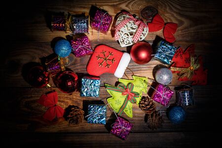 Beautiful Christmas toys on the holiday tree on a wooden vintage tableの写真素材