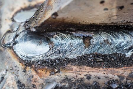 Welding seam on metal close on metal constructionの写真素材