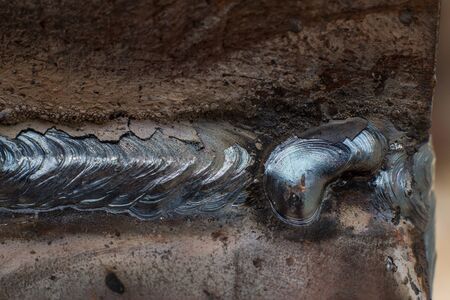 Welding seam on metal close on metal constructionの写真素材