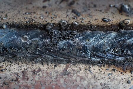 Welding seam on metal close on metal constructionの写真素材