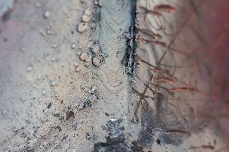 Welding seam on metal close on metal constructionの写真素材