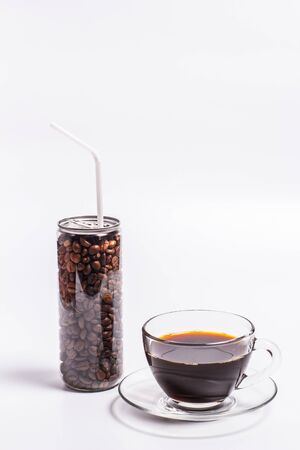 Coffee beans in a plastic jar on a white backgroundの写真素材