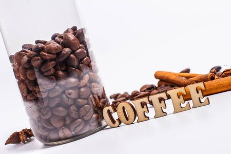 Coffee beans in a plastic jar on a white backgroundの写真素材