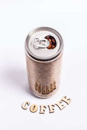 Coffee beans in a plastic jar on a white backgroundの写真素材