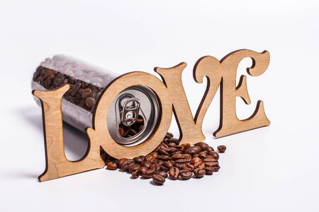 Coffee beans in a plastic jar on a white backgroundの写真素材