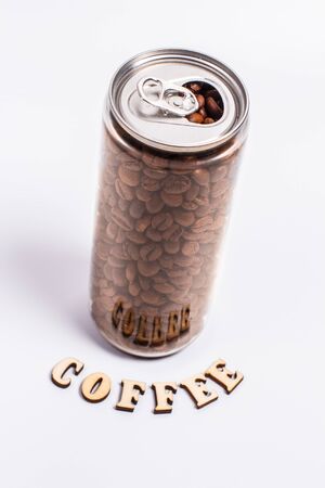 Coffee beans in a plastic jar on a white backgroundの写真素材