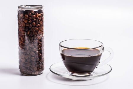 Coffee beans in a plastic jar on a white backgroundの写真素材