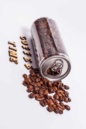Coffee beans in a plastic jar on a white backgroundの写真素材