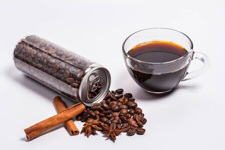 Coffee beans in a plastic jar on a white backgroundの写真素材