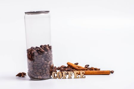 Coffee beans in a plastic jar on a white backgroundの写真素材