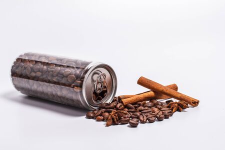 Coffee beans in a plastic jar on a white backgroundの写真素材