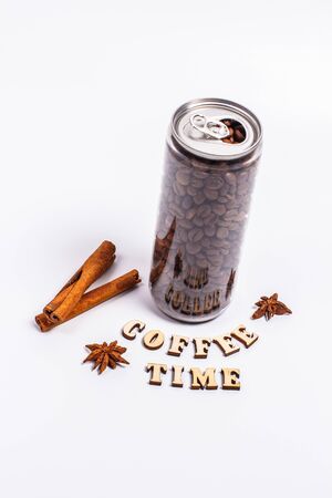 Coffee beans in a plastic jar on a white backgroundの写真素材