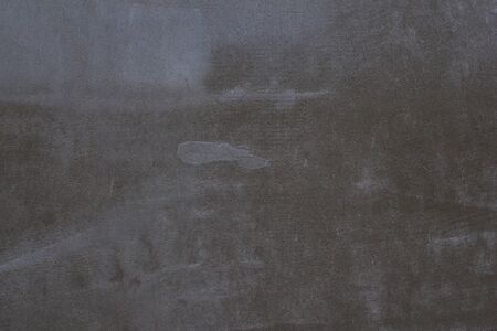 Gray concrete wall texture with scratches and cracks on it.の写真素材