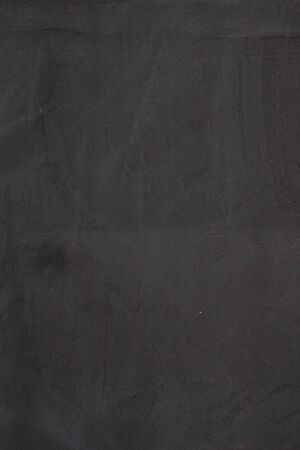 Gray concrete wall texture with scratches and cracks on it.の写真素材