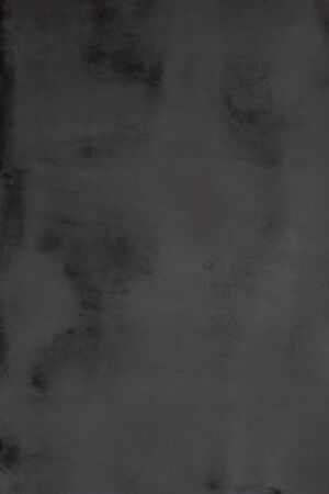 Gray concrete wall texture with scratches and cracks on it.の写真素材