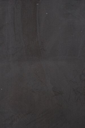 Gray concrete wall texture with scratches and cracks on it.の写真素材