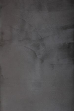 Gray concrete wall texture with scratches and cracks on it.の写真素材