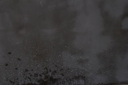 Gray concrete wall texture with scratches and cracks on it.の写真素材