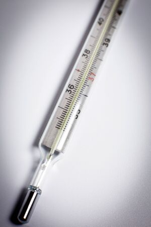 Thermometer for measuring temperature on a white background
