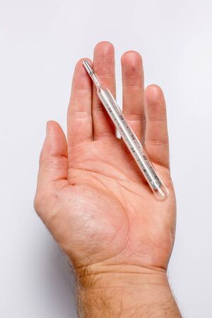 Thermometer for measuring the temperature in the handの写真素材