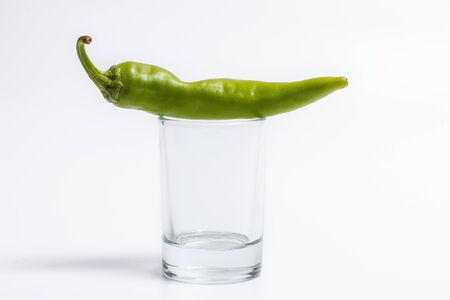 Hot peppers for spicy dishes on a white backgroundの写真素材