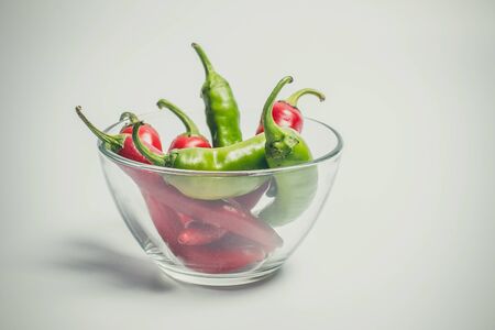 Hot peppers for spicy dishes on a white backgroundの写真素材