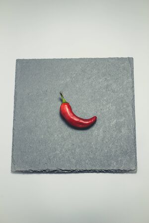 Hot peppers for spicy dishes on a white background
