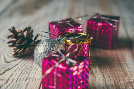 Christmas toys to decorate the holiday tree on a wooden white table