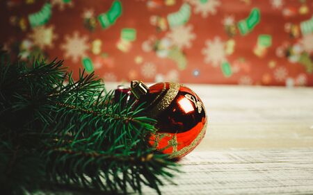 Christmas toys to decorate the holiday tree on a wooden white tableの写真素材