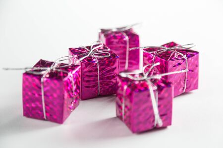 Christmas toys to decorate the holiday tree on a wooden white table